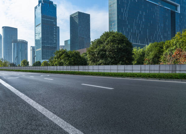 istock Empty asphalt road through modern city in Shanghai, China 1343653415