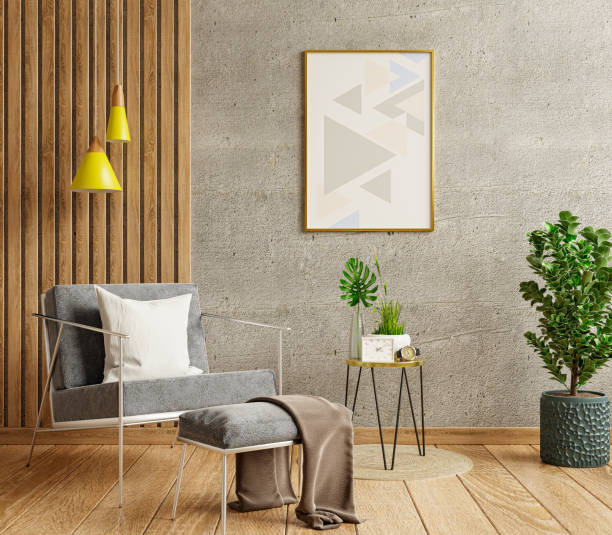 istock Mockup poster frame in a modern living room with an empty concrete wall. 1343665813