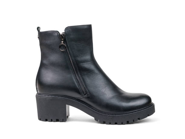 istock Elegant women's leather black ankle boots isolated on a white background. 1343667309