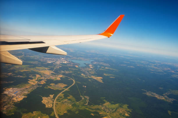 istock Classic image through aircraft window onto wing. Flight view over Russia 1343671177