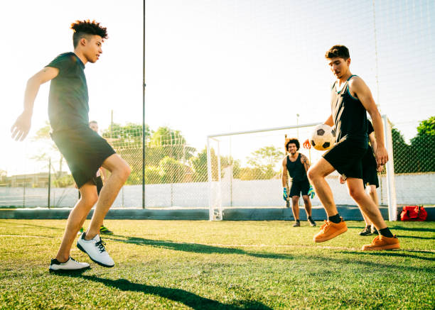 istock Male players practicing soccer on sunny day 1343674402