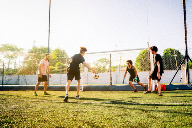 istock Male player scoring goal in soccer field 1343674403