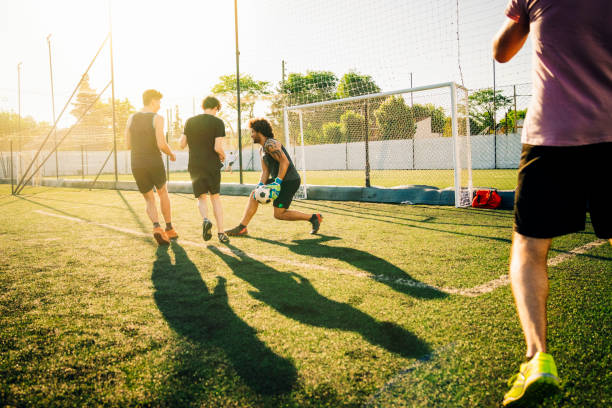 istock Male goalie defending while playing soccer 1343674498