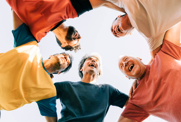 istock Male players huddling while playing soccer 1343674840