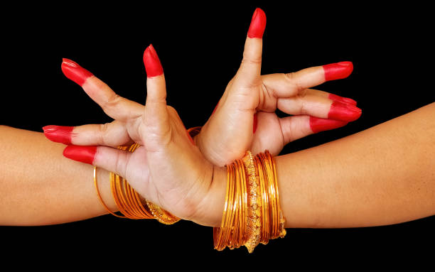 Female dancer hand in black background demonstrating Bharatanatyam Indian classical dance mudra Female classical dancer hands on black background showing "Katakavardhana hasta" denoting a coronation ceremony, worship or marriage as a mudra of Bharata Natyam dance bharatanatyam dancing stock pictures, royalty-free photos & images