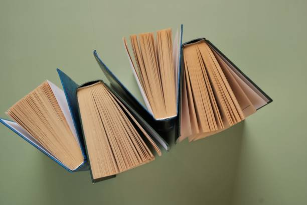 istock Books close-up on green background.Reading of books.Knowledge and Learning.Reading and education.literature and trainings. 1343676731