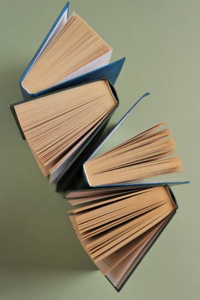 istock Books close-up on green background.Reading of books.Knowledge and Learning.Reading and education. 1343676735