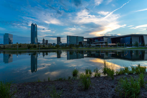 Oklahoma City downtown buildings in summer morning Oklahoma City downtown buildings reflect in a pond water in morning light oklahoma city stock pictures, royalty-free photos & images