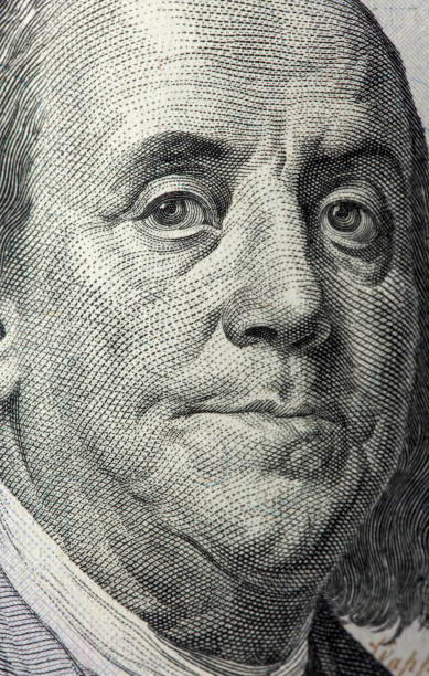 istock Benjamin Franklin on a US $100 banknote close-up 1343680173