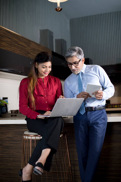 Business people using laptop and digital tablet at office