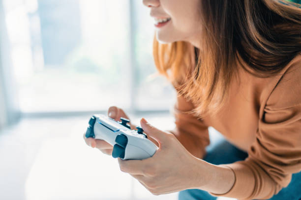 istock Woman hand playing a computer games with joystick 1343691456