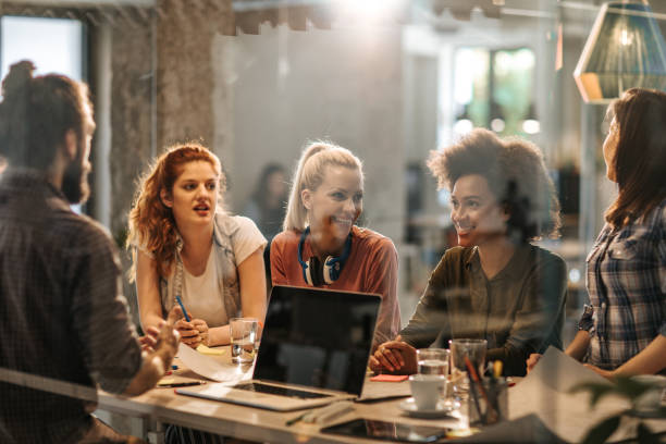 istock Young freelance workers communicating on a casual meeting in the office. 1343691536