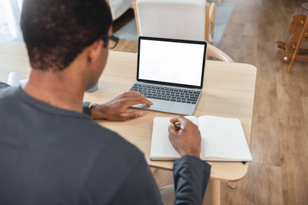istock African American man Freelancer using laptop while working at home. 1343691582