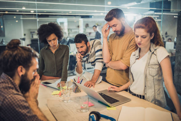istock Group of worried freelance workers having problems in the office. 1343691741