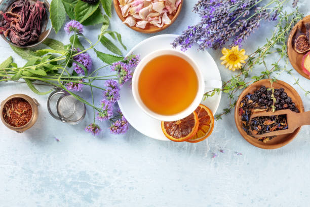 istock Tea, overhead shot with copy space. Herbs, flowers and fruit 1343692896