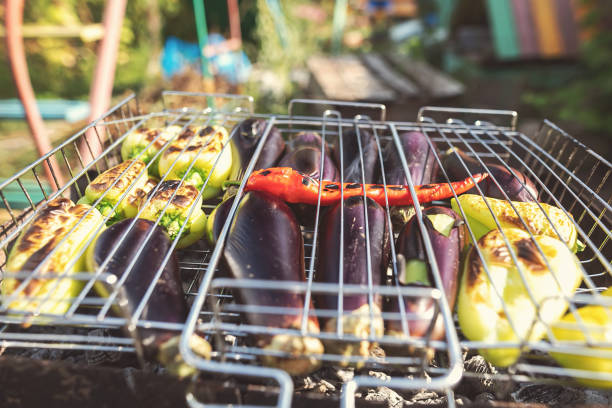 Preparation of vegetables: eggplant, paprica and chili pepper. On the grill for hot salad