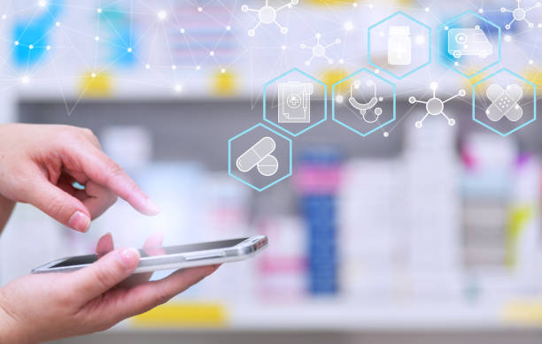 istock Pharmacist using mobile smart phone for search bar on display in pharmacy 1343695564