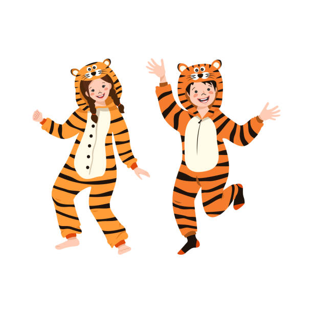 Girl and boy in orange carnival costume of tiger Girl and boy in orange carnival costume of tiger. Children pajama party. Kids in jumpsuits or kigurumi, festive clothing for New year, Christmas or holiday kid animal costume stock illustrations