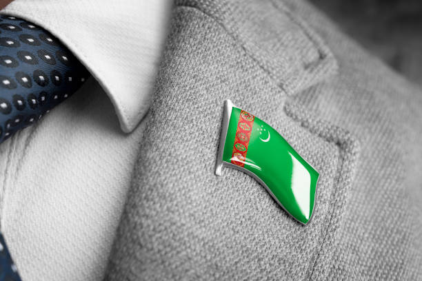 metal badge with the flag of turkmenistan on a suit lapel - lapel brooch badge suit imagens e fotografias de stock