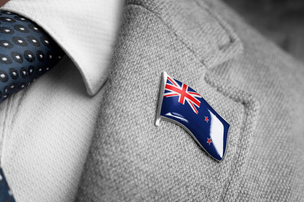 metal badge with the flag of new zealand on a suit lapel - lapel brooch badge suit imagens e fotografias de stock