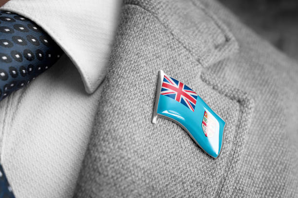 metal badge with the flag of fiji on a suit lapel - lapel brooch badge suit imagens e fotografias de stock