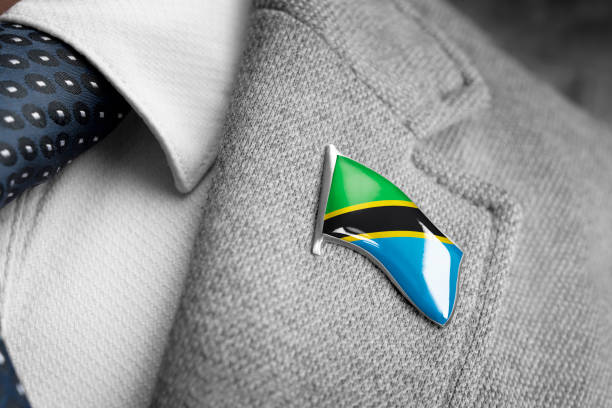 metal badge with the flag of tanzania on a suit lapel - lapel brooch badge suit imagens e fotografias de stock