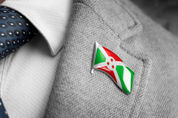 metal badge with the flag of burundi on a suit lapel - lapel brooch badge suit imagens e fotografias de stock
