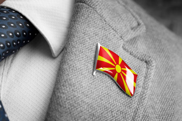 metal badge with the flag of macedonia on a suit lapel - lapel brooch badge suit imagens e fotografias de stock