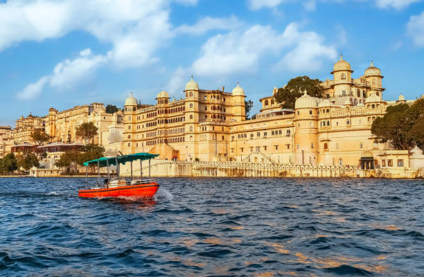 Udaipur City Palace beside beautiful Lake Pichola at Udaipur, Rajasthan, India stock photo