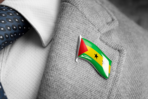 Metal badge with the flag of Sao Tome and Principe on a suit lapel.