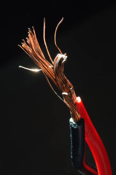 istock bare copper wires in black and red on a dark background. macro 1343702994