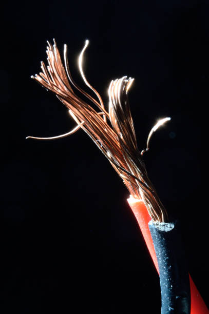 istock bare copper wires in black and red on a dark background. macro 1343703073
