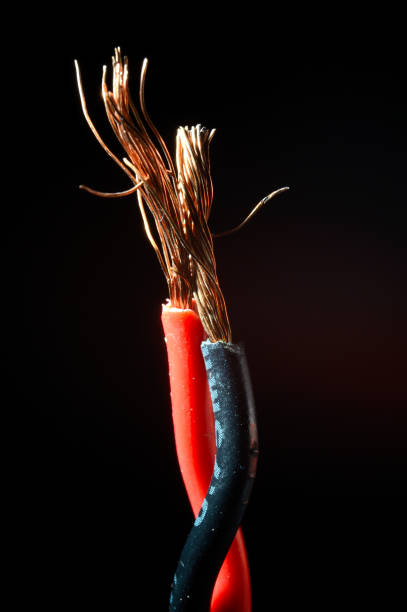 istock bare copper wires in black and red on a dark background. macro 1343703075