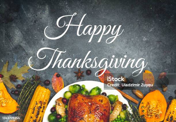 Happy Thanksgiving Lettering On A Festive Dinner Background Food Table Background With Autumn Seasonal Specialties For Thanksgiving Day Fried Chicken With Pumpkin Vegetables And Autumn Decor Stock Photo - Download Image Now