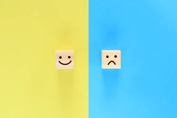 istock Building blocks with smiling and angry faces. 1343713044