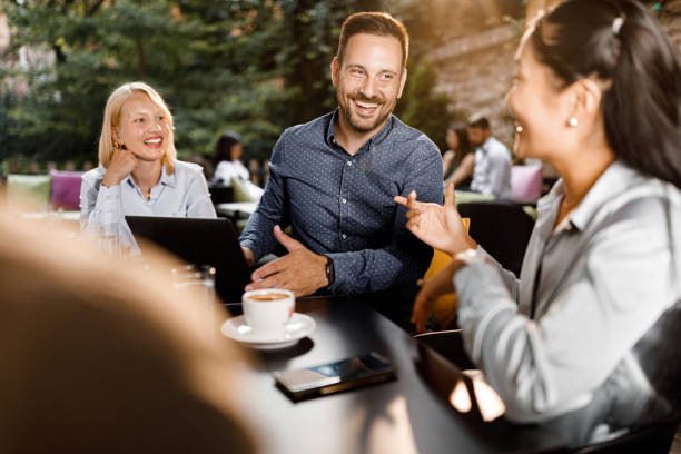 istock Happy colleagues talking on a casual meeting in a cafe. 1343716529