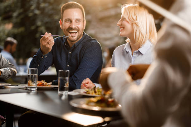istock Happy business colleagues talking on a lunch in a restaurant. 1343718960