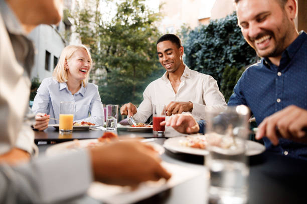 istock Happy business colleagues having lunch in a restaurant. 1343719390
