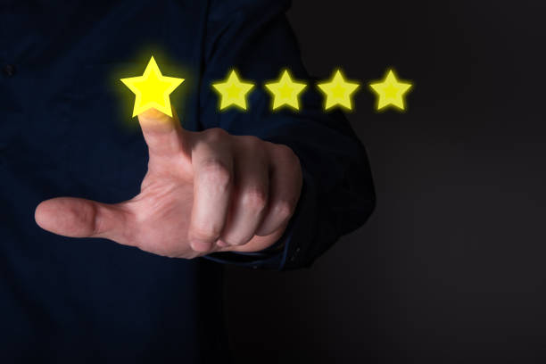 istock Business people click five stars on the visual screen in the Customer Service Concept concept. 1343725254