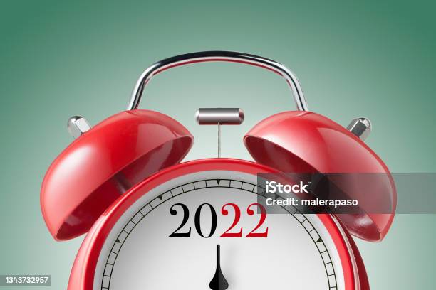 New Year 2022 Close Up View Of A Red Alarm Clock Stock Photo - Download Image Now - 2022, Alarm Clock, Deadline