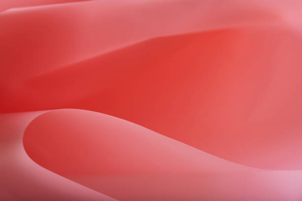 istock red abstract silk curved paper background 1343741218