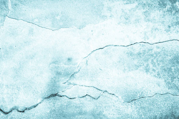 istock Pastel Blue and White concrete stone texture for background in summer wallpaper. Cement and sand wall of tone vintage. Concrete abstract wall of light cyan color, cement texture mint green for design. 1343745772