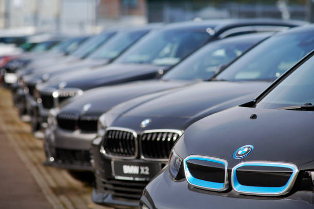 New BMW cars for sale Neuss, Germany- Sept., 28, 2021: Row of new BMW cars in front of car dealer. The first car is an electric i3, the second a X2. bmw dealership stock pictures, royalty-free photos & images