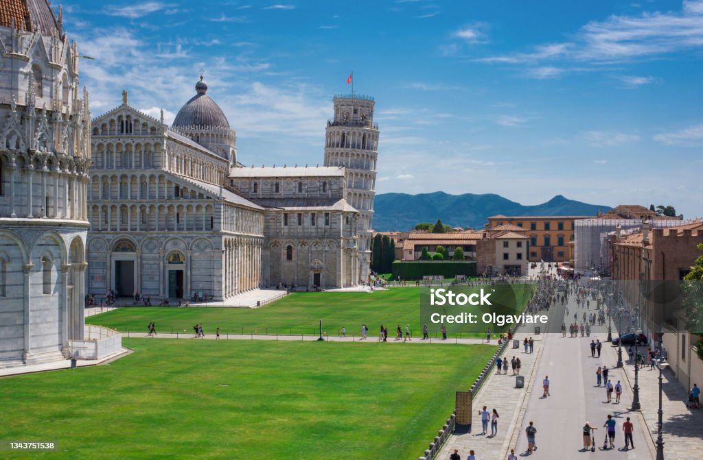 Shot from the ancient walls of Pisa. Square of Miracles with Pisa’s Leaning Tower, Cathedral of Santa Maria Assunta and Baptistery in Pisa, Tuscany, Italy. Pisa Stock Photo
