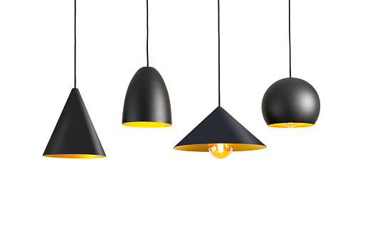 Four black illuminated electric lamps hanging from ceiling isolated on white background.