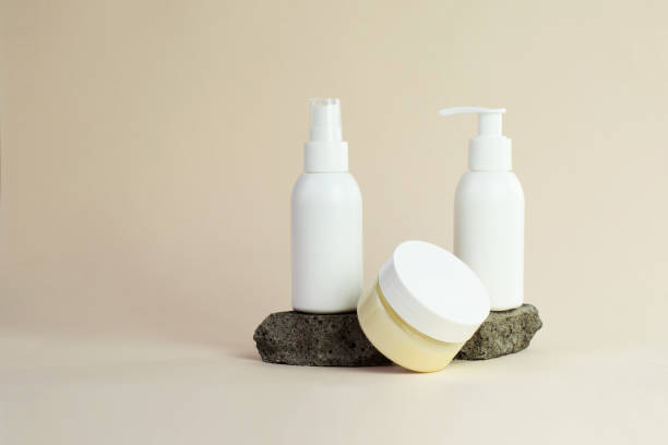 istock White cosmetics plastic bottles on beige background 1343760649
