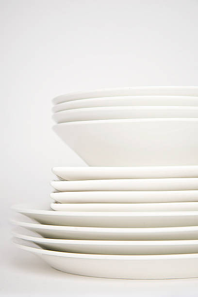 Stack of white plates stock photo