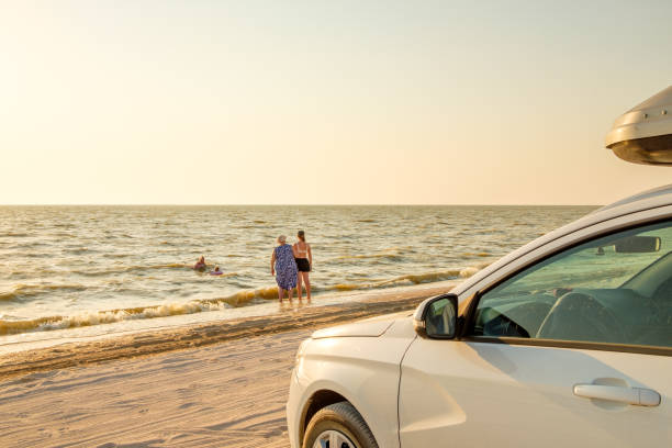 One red car parked by the Sea