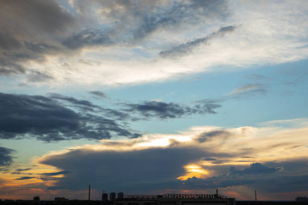 istock Sunset with beautiful clouds above town 1343765872
