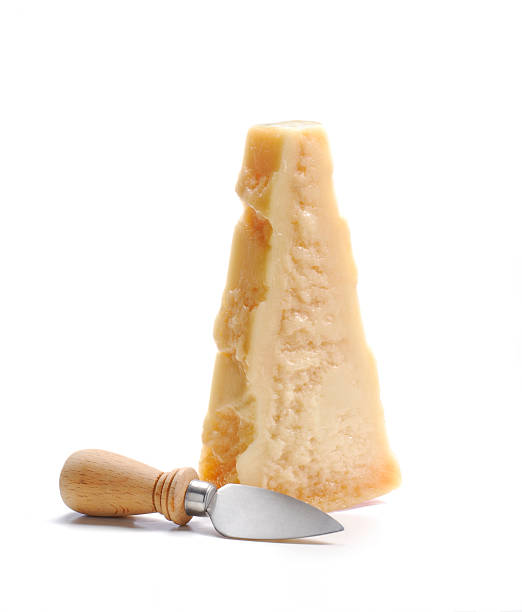 istock Chunk of fresh Parmesan cheese with knife next to it 134377052